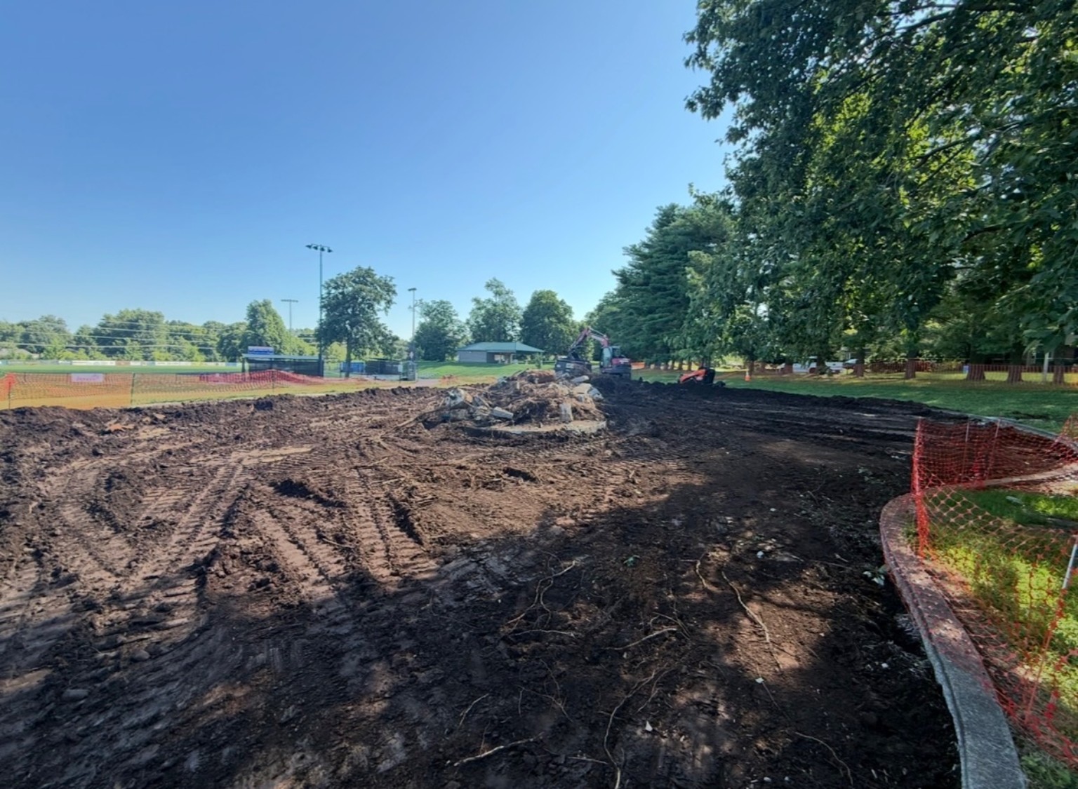 Playground demolition site after equipment removal and ground clearing